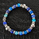 Armband aus Silber und Perlen mit FACETTIERTEN SILBERKUGELN auf Kautschuk