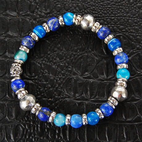 Armband aus Silber und Perlen mit FACETTIERTEN SILBERKUGELN auf Kautschuk